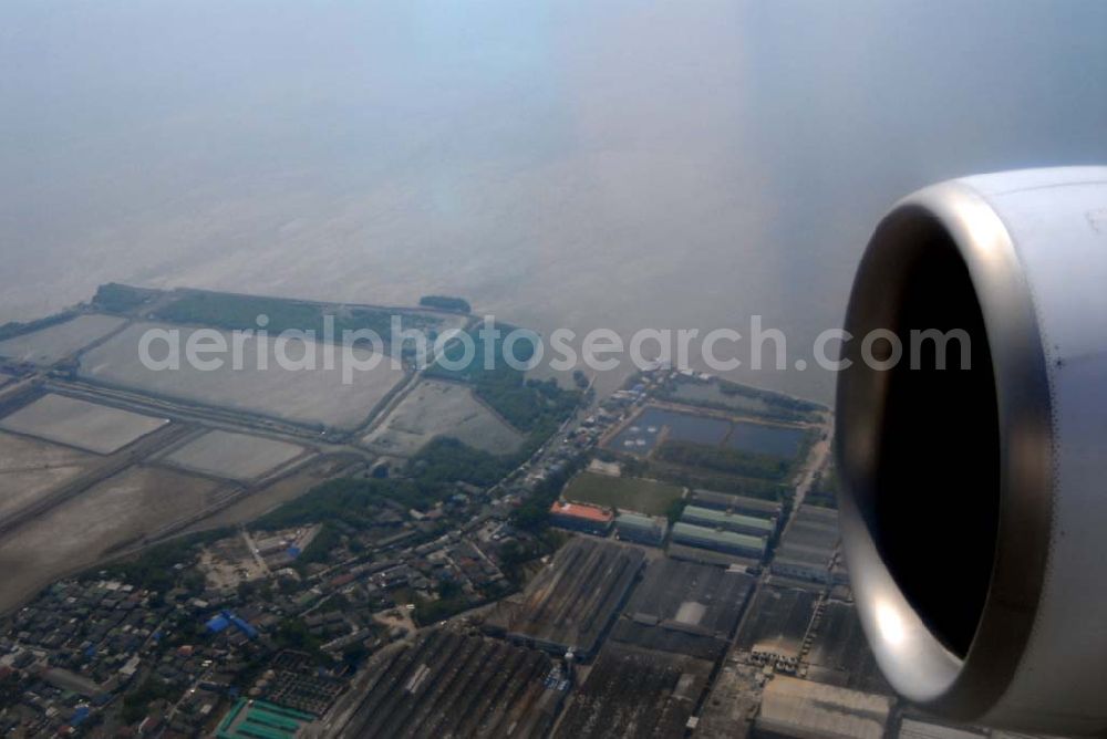 Bangkok / Thailand from the bird's eye view: Landeanflug mit einem Airbus A330 der LTU auf dem Flughafen Bangkok International von Norden her über Reisanbaugebiete am Stadtrand