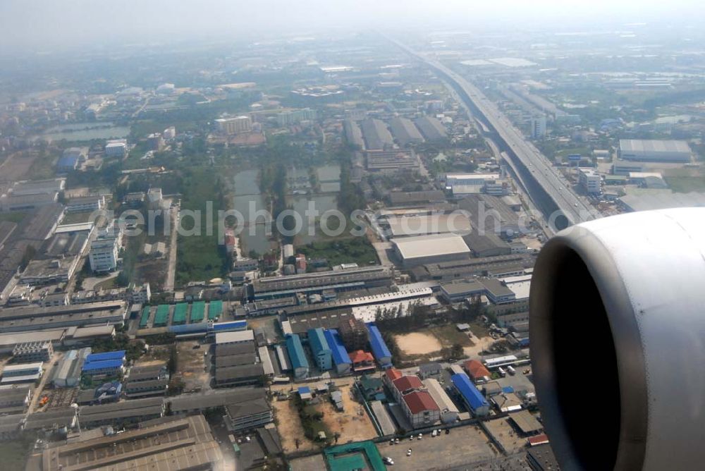 Bangkok / Thailand from the bird's eye view: Landeanflug mit einem Airbus A330 der LTU auf dem Flughafen Bangkok International von Norden her über Reisanbaugebiete am Stadtrand