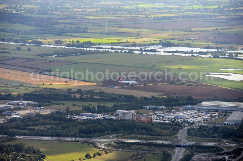 Aerial image Bremen - Aircraft of Turkish Airlines with type designation A319-132/100 in flight over the airspace in Bremen near interchange Bremen-Hemelingen in Germany