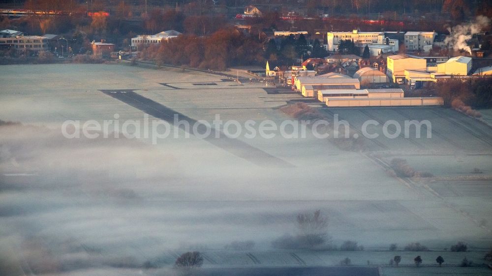 Hamm from above - Runway 06 24 of airfield Hamm-Lippewiesen EDLH in morning fog at sunrise in Hamm, North Rhine-Westphalia