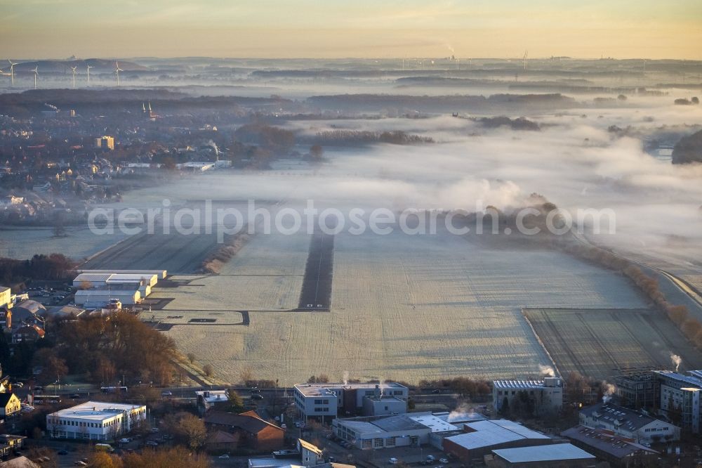 Aerial photograph Hamm - Runway 06 24 of airfield Hamm-Lippewiesen EDLH in morning fog at sunrise in Hamm, North Rhine-Westphalia