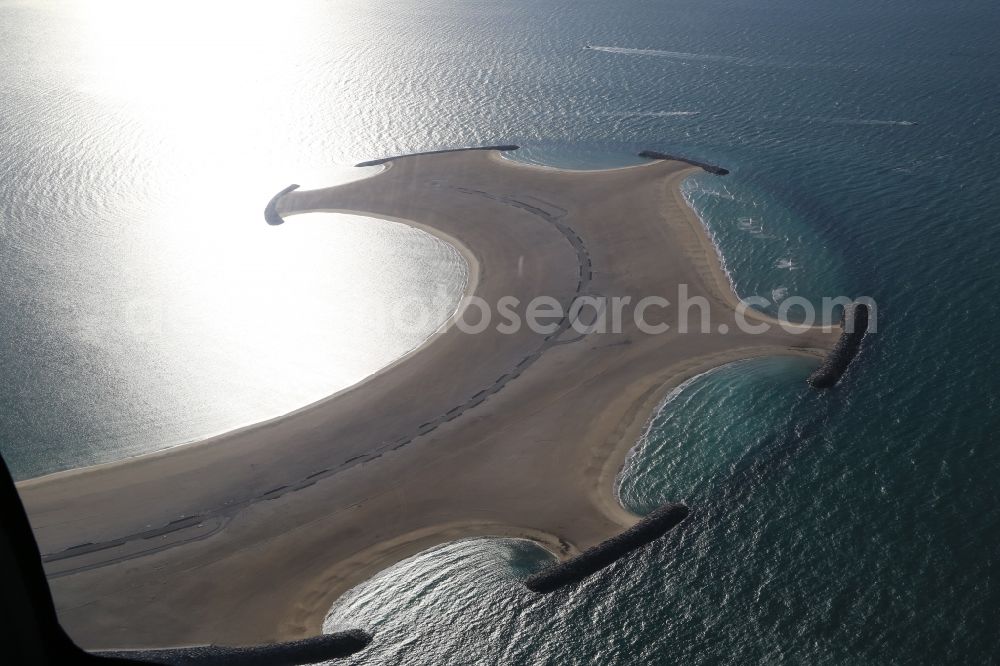 Dubai from above - Land reclamation off the coast of Dubai in United Arab Emirates. The artificially reclaimed island in the Gulf of Arabia is opened and until the EXPO 2020 also built with houses