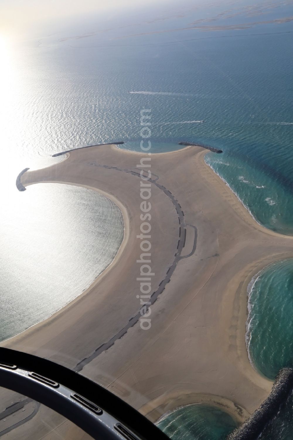 Dubai from the bird's eye view: Land reclamation off the coast of Dubai in United Arab Emirates. The artificially reclaimed island in the Gulf of Arabia is opened and until the EXPO 2020 also built with houses