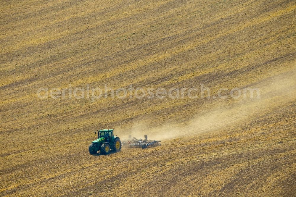 Meschede from above - Farm equipment used for aerating fields in Meschede in the state North Rhine-Westphalia