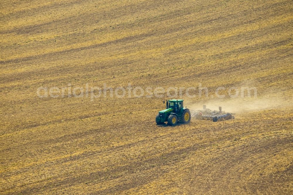 Meschede from the bird's eye view: Farm equipment used for aerating fields in Meschede in the state North Rhine-Westphalia