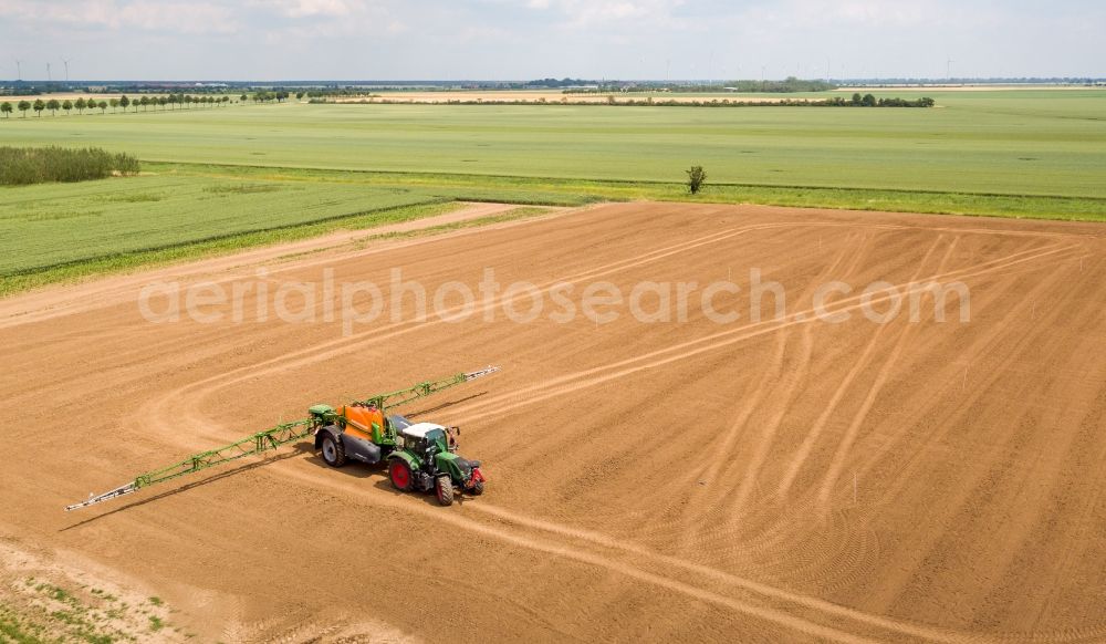 Aerial image Arzberg - Farm equipment used for fertilizing fields in Arzberg in the state Saxony, Germany