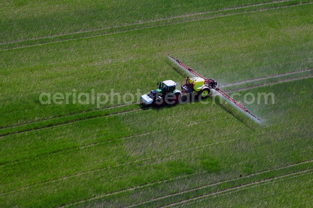 Aerial photograph Dolgen - Farm equipment used for fertilizing fields in Dolgen in the state Mecklenburg - Western Pomerania, Germany