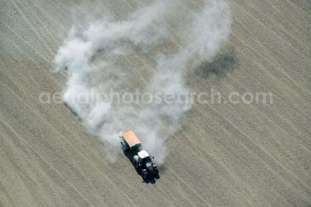 Aerial image Lietzen - Farm equipment used for fertilizing fields in Lietzen in the state Brandenburg