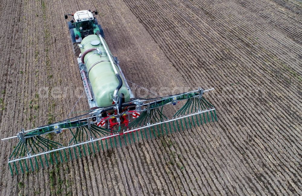 Sieversdorf from the bird's eye view: Farm equipment used for fertilizing fields in Sieversdorf in the state Brandenburg, Germany