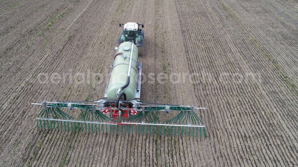 Sieversdorf from the bird's eye view: Farm equipment used for fertilizing fields in Sieversdorf in the state Brandenburg, Germany