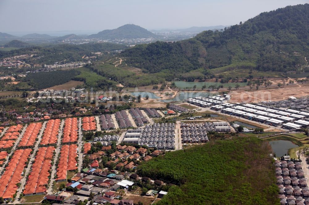 Koh Keaw from the bird's eye view: Landscape with lakes, homes and settlements in Koh Keaw on Phuket island in Thailand