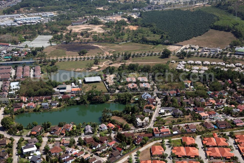 Aerial image Koh Keaw - Landscape with lakes, homes and settlements in Koh Keaw on Phuket island in Thailand