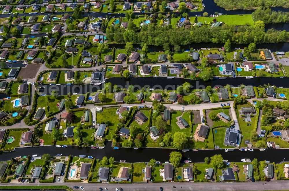 Loosdrecht from above - Landscape with boat houses and docks with bungalow settlement near Loosdrecht in Holland - Netherlands