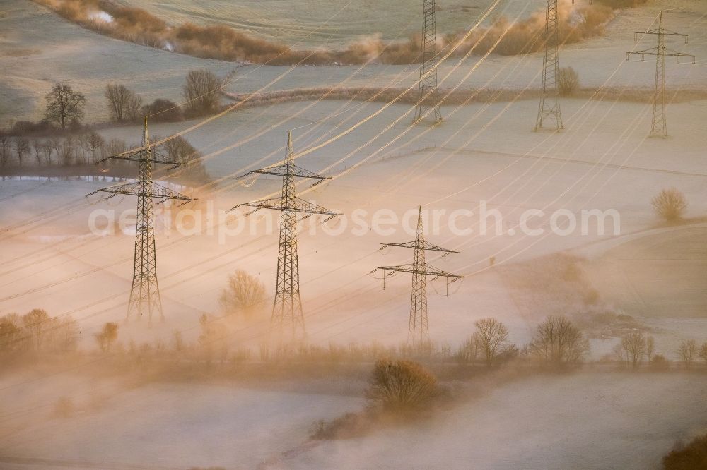 Hamm from the bird's eye view: Landscape with morning fog over the power poles in the meadows of Lippeauen at sunrise on coal-fired power plant of RWE in the district Schmehausen of Hamm in North Rhine-Westphalia