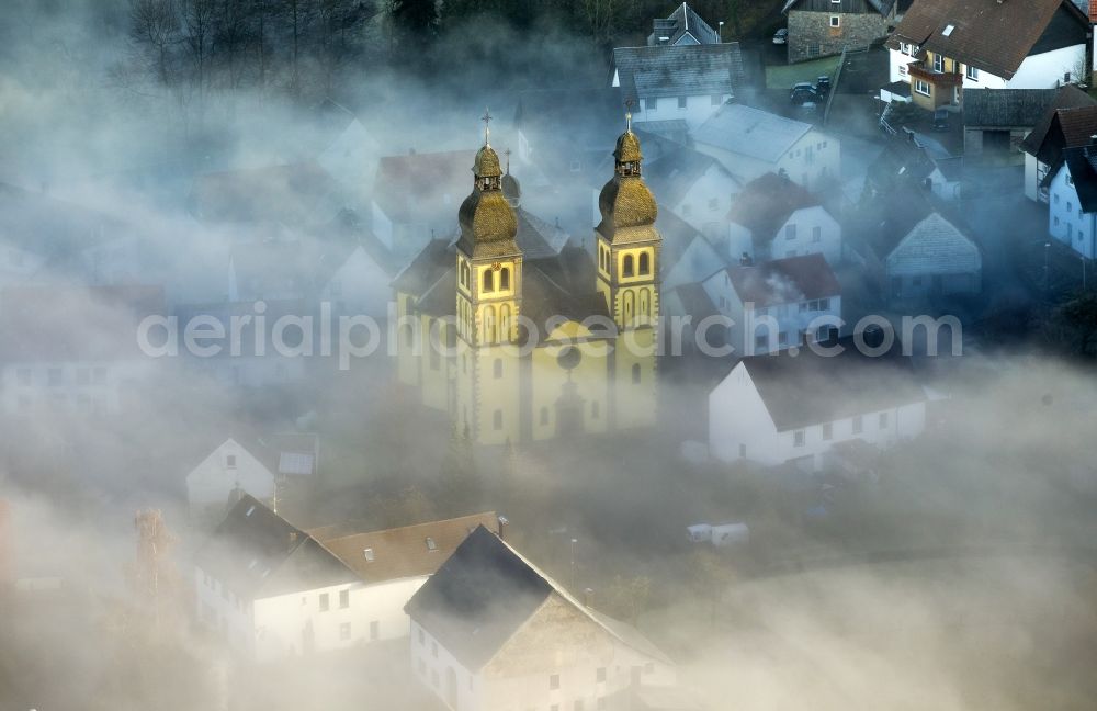 Aerial image Marsberg OT Padberg - From fog layer and clouds outstanding Church of St. Mary Magdalene - also Padberger Dom-in Padberg, a district of Marsberg in North Rhine-Westphalia
