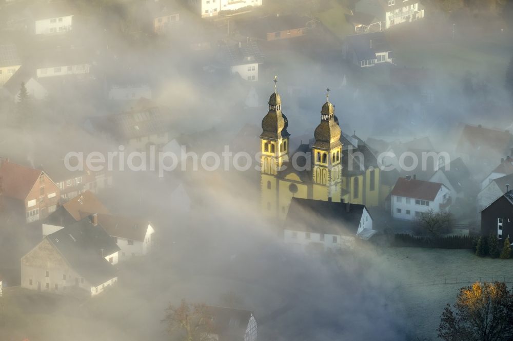 Marsberg OT Padberg from above - From fog layer and clouds outstanding Church of St. Mary Magdalene - also Padberger Dom-in Padberg, a district of Marsberg in North Rhine-Westphalia