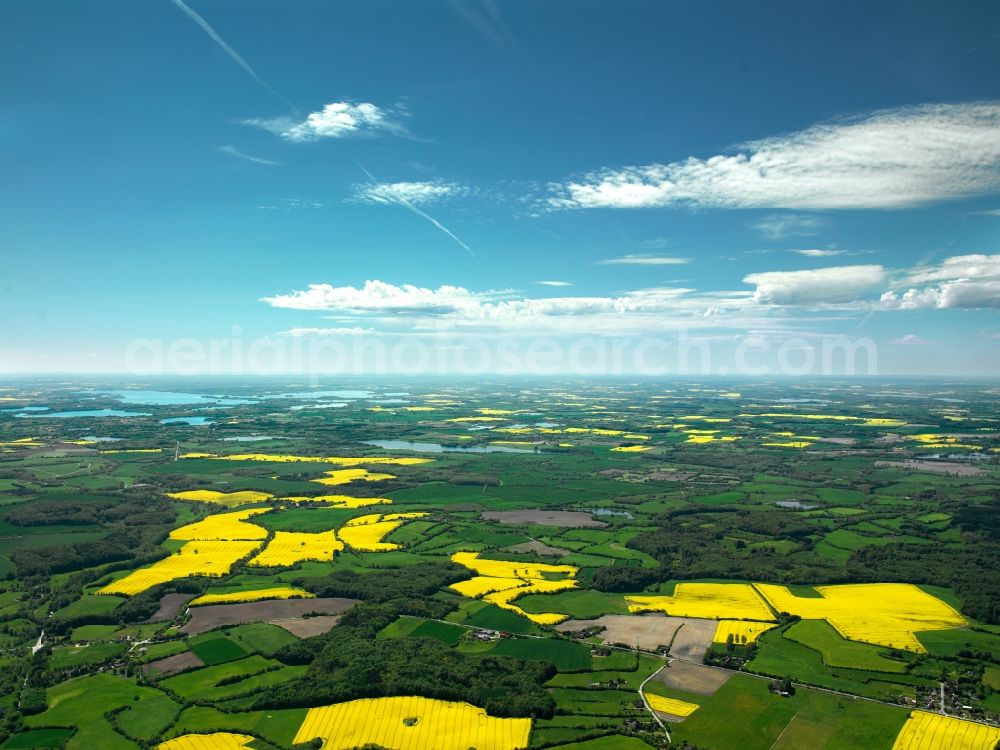 Aerial photograph Plön - Landscape and panoramic view of the district of Ploen in the state of Schleswig-Holstein. District capital is the town of Ploen, located on Ploen Lake and surrounded by the lake district of Holstein Switzerland. The important tourism region is characterised by agriculture and rapeseed fields as well as 11 lakes that belong to the urban area of Ploen and another 5 lakes of different sizes around Ploen