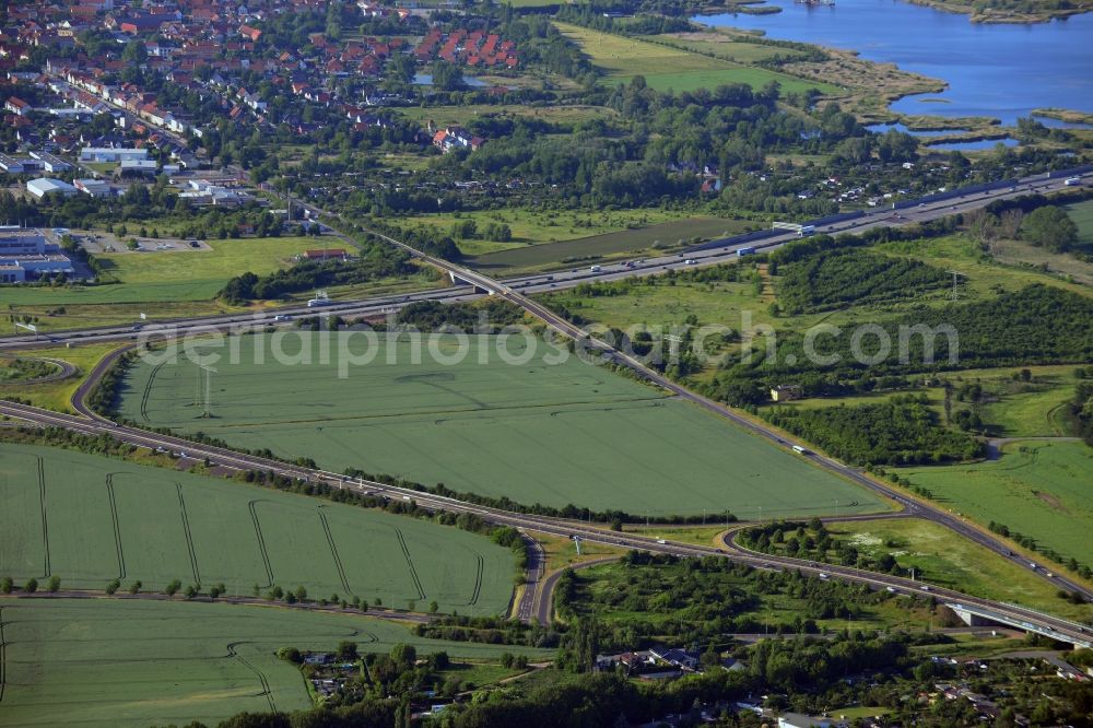 Magdeburg from above - Landscape, lakes and road network in the North of Magdeburg in the state of Saxony-Anhalt. The foreground shows the federal highway B189 taking its course along the lake Neustaedter See II in the district of the same name. The background shows the federal motorway A2 along a small lakes region with the Boettchersee and the Adamsee lakes next to the borough of Barleben