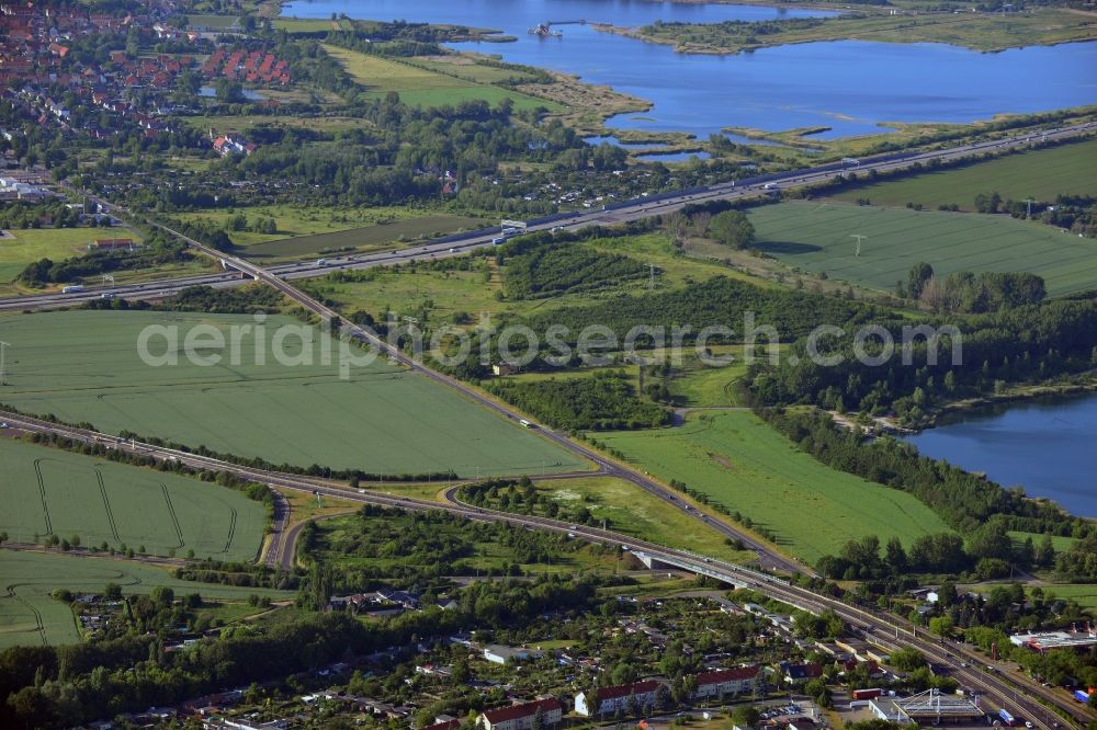 Magdeburg from the bird's eye view: Landscape, lakes and road network in the North of Magdeburg in the state of Saxony-Anhalt. The foreground shows the federal highway B189 taking its course along the lake Neustaedter See II in the district of the same name. The background shows the federal motorway A2 along a small lakes region with the Boettchersee and the Adamsee lakes next to the borough of Barleben