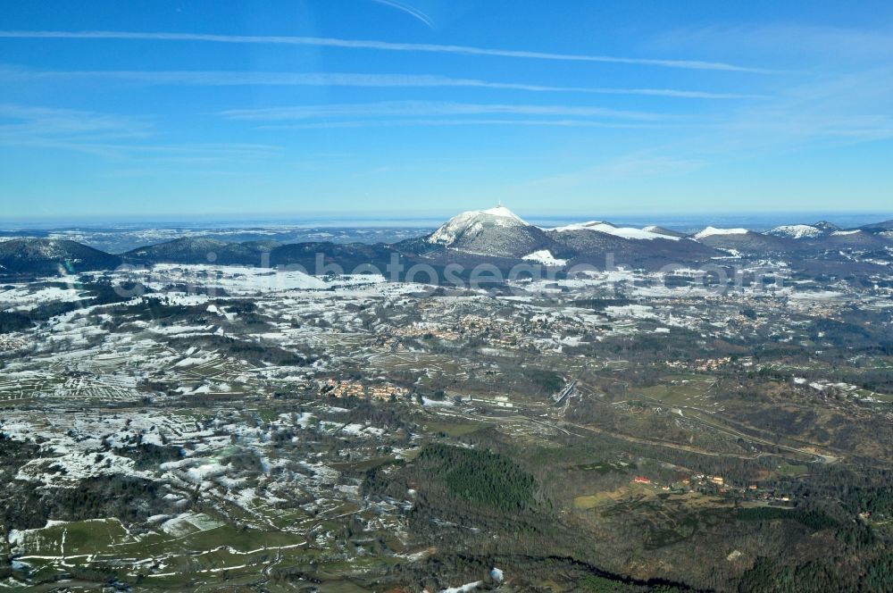 Aerial image Fontanas - In veiled sunset with fog volcanic mountain Puy-de-Dome in the province of Auvergne in France