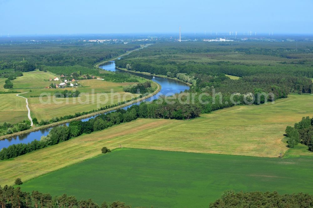 Aerial photograph Genthin - Landscape on the riverbank and course of the Elbe-Havel canal in Genthin in the state of Saxony-Anhalt. The canal is surrounded by forest and fields. Genthin is located in the background