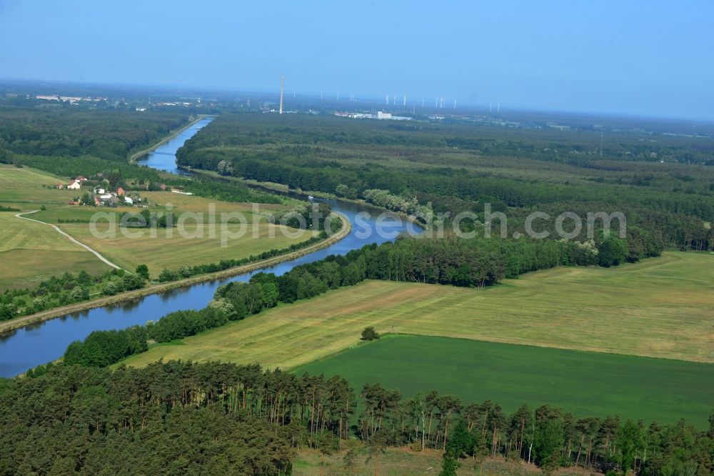 Genthin from the bird's eye view: Landscape on the riverbank and course of the Elbe-Havel canal in Genthin in the state of Saxony-Anhalt. The canal is surrounded by forest and fields. Genthin is located in the background