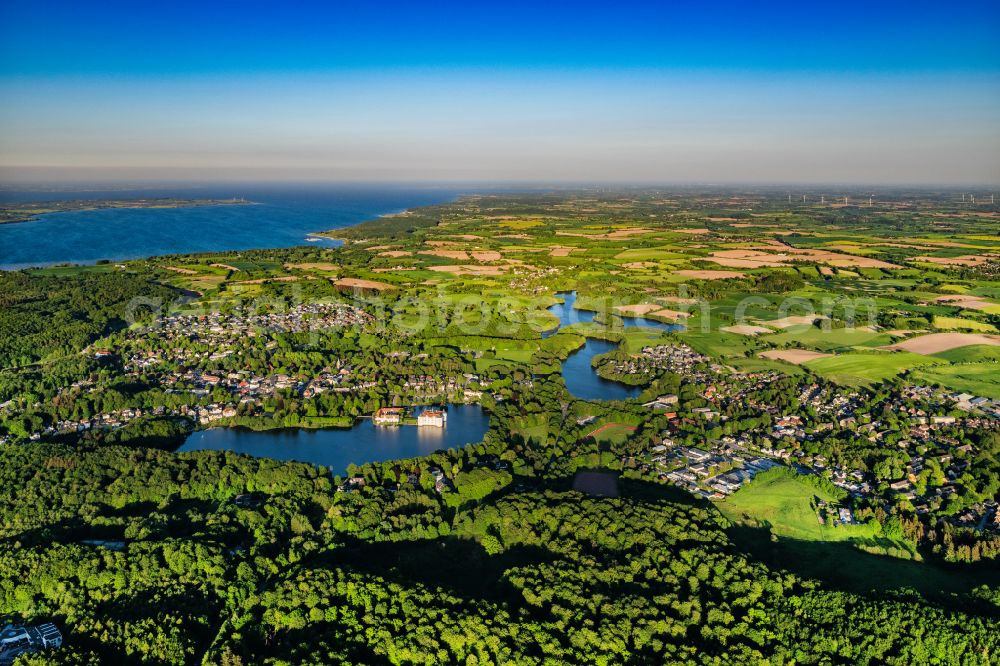 Aerial photograph Glücksburg - Landscape with water castle and woods in Gluecksburg in Schleswig-Holstein