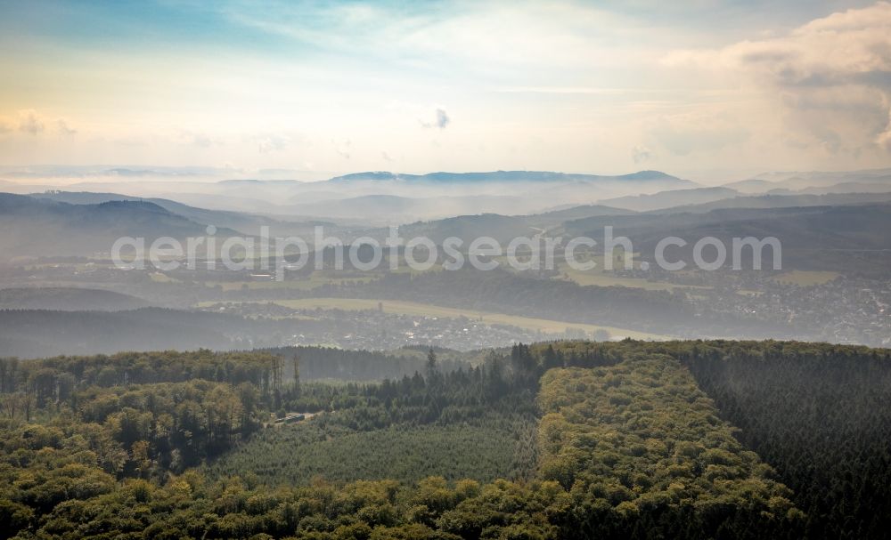 Aerial photograph Arnsberg - Landscape view over the treetops of a wooded area with view of Arnsberg in the state North Rhine-Westphalia, Germany