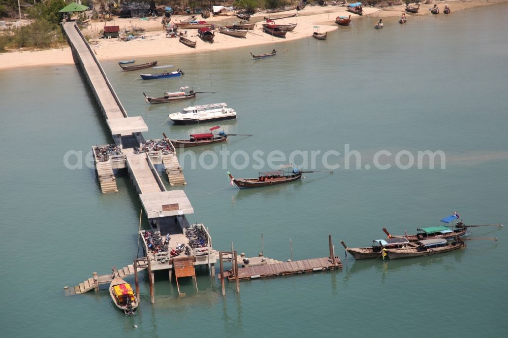 Aerial image Koh Keaw - Pier of the island Ko Maphrao east of the city Koh Keaw on the island of Phuket in Thailand with a sandy beach and typical local boats