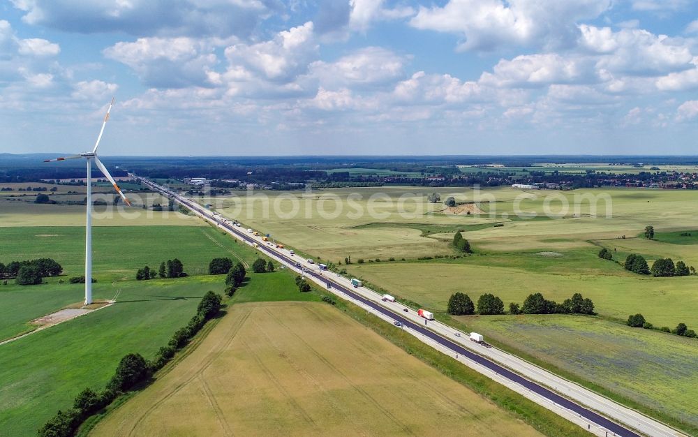 Biegen from the bird's eye view: Agricultural fields surround the lanes of the motorway route and the route of the BAB A 12 in Biegen in the state Brandenburg, Germany