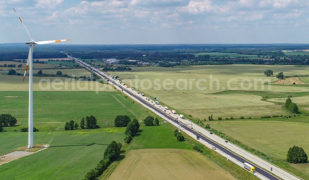 Aerial image Biegen - Agricultural fields surround the lanes of the motorway route and the route of the BAB A 12 in Biegen in the state Brandenburg, Germany