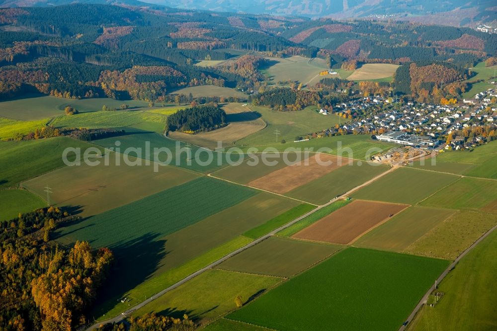 Finnentrop from above - Agricultural area in the East of Finnentrop in the state of North Rhine-Westphalia. A new commercial area is planned on site of the fields