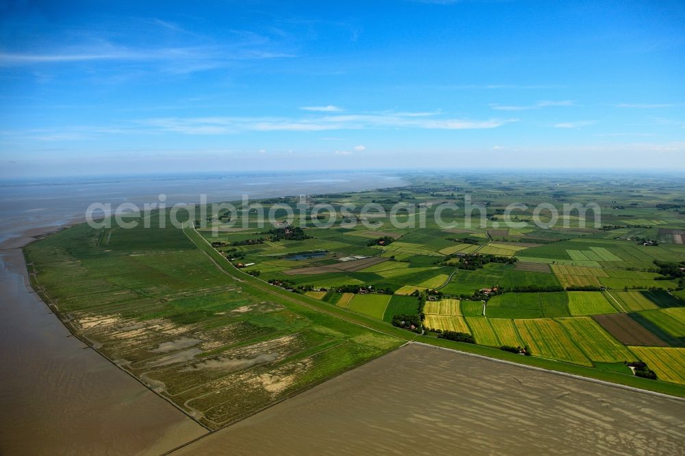 Aerial image Butjadingen - Embankment of Langwarden in Butjadingen in the state of Lower Saxony. View from the North of the coast of Langwarden with its fields and the embankments and levees that protect the land