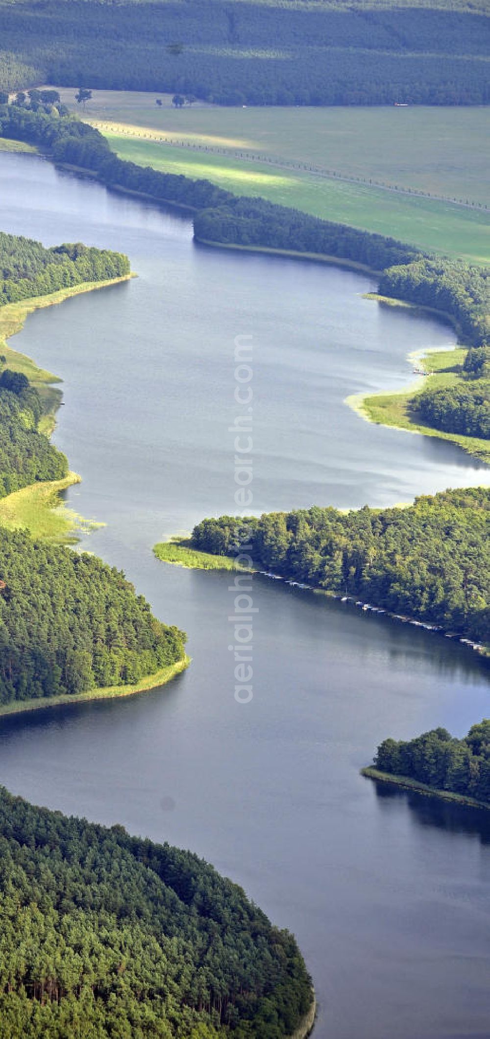 Templin from above - Blick auf den Lübbesee bei Templin. Der flussartige See erstreckt sich über eine Länge von 12 km. View of the Lübbesee at Templin. The riverine lake extends over a length of 12 km.