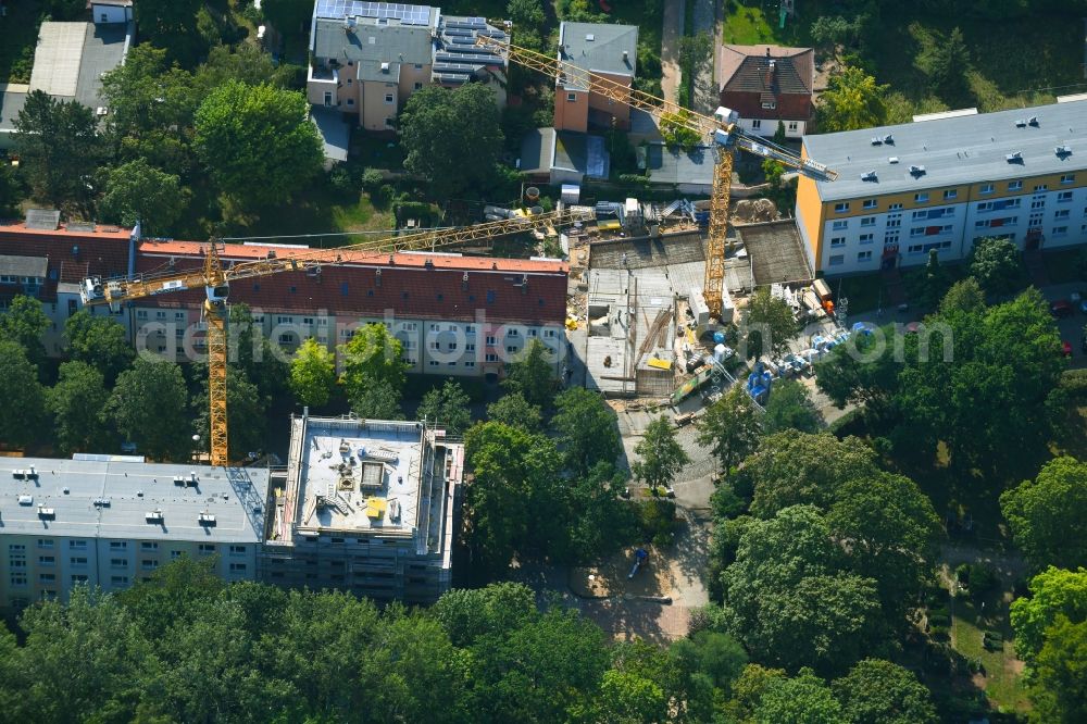 Berlin from above - Construction site for the construction of gaps along the multi-family house residential housing estate Friedlander Strasse in the district Adlershof in Berlin, Germany