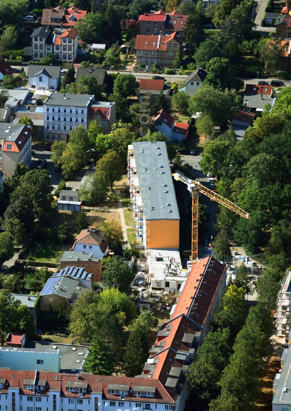 Berlin from above - Construction site for the construction of gaps along the multi-family house residential housing estate Friedlander Strasse in the district Adlershof in Berlin, Germany