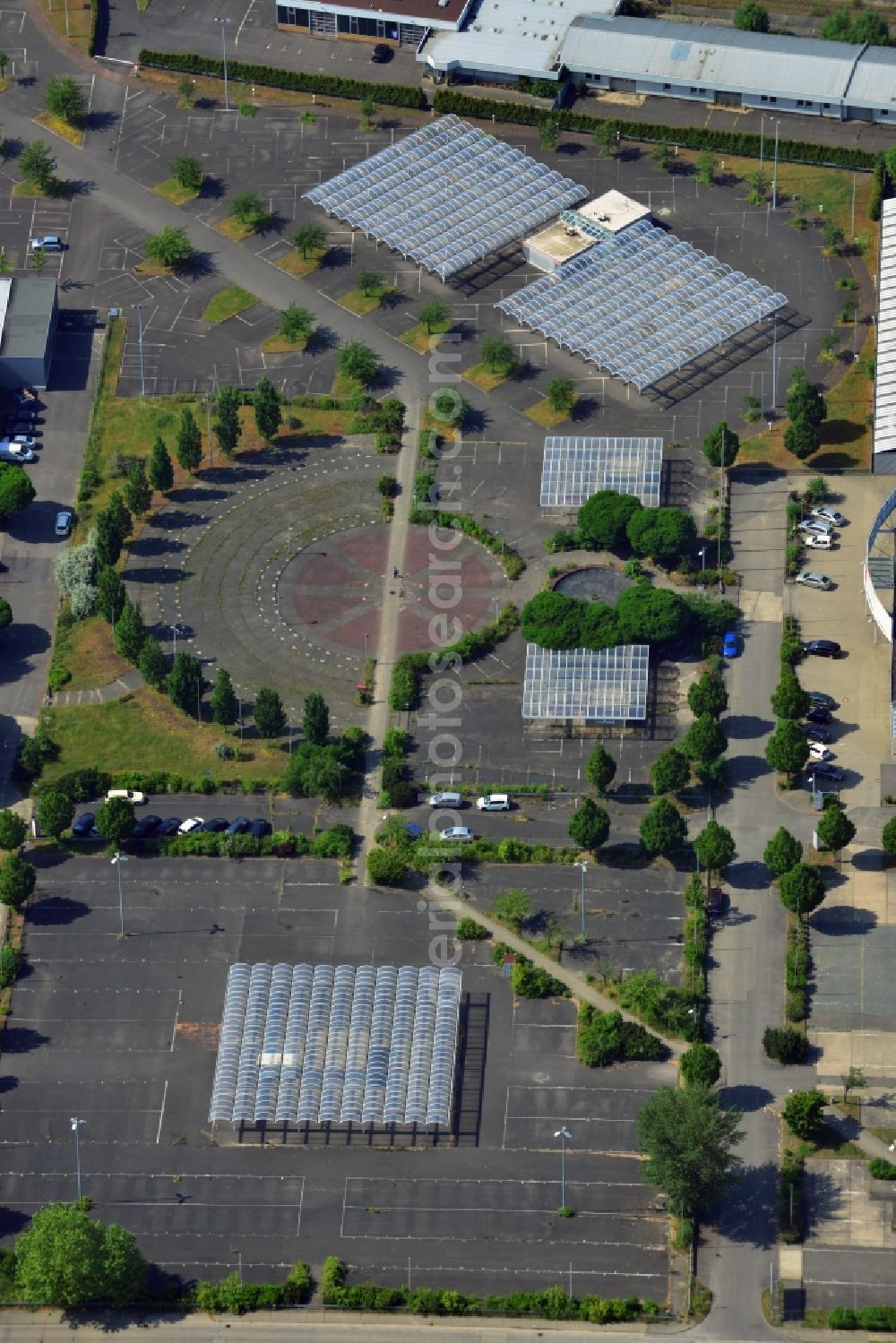 Hoppegarten from above - The Carena car park Hoppegarten in the state of Brandenburg is one of the biggest used car markets in the region. On the grounds cars are bought, processed and resold. Services include car financing and a repair shop