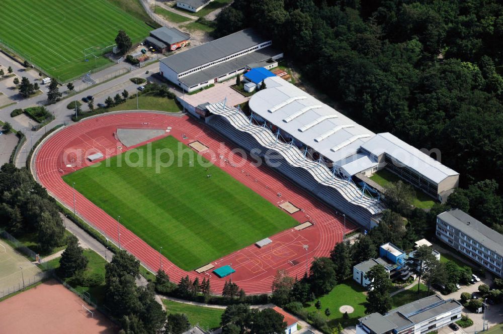 Aerial photograph Rostock - Im Leichtathletikstadion in Rostock, Mecklenburg-Vorpommern finden Veranstaltungen und Wettkämpfe des Kreis-Leichtathletik-Verband Rostock e.V. sowie des Leichtathletik-Verband Mecklenburg-Vorpommern statt. Das Stadion befindet sich neben der DKB Arena. The athletic sports stadium is the location for events of the Kreis-Leichtathletik-Verband Rostock e.V. and the Leichtathletik-Verband Mecklenburg-Vorpommern. It is located close to the DKB Arena.