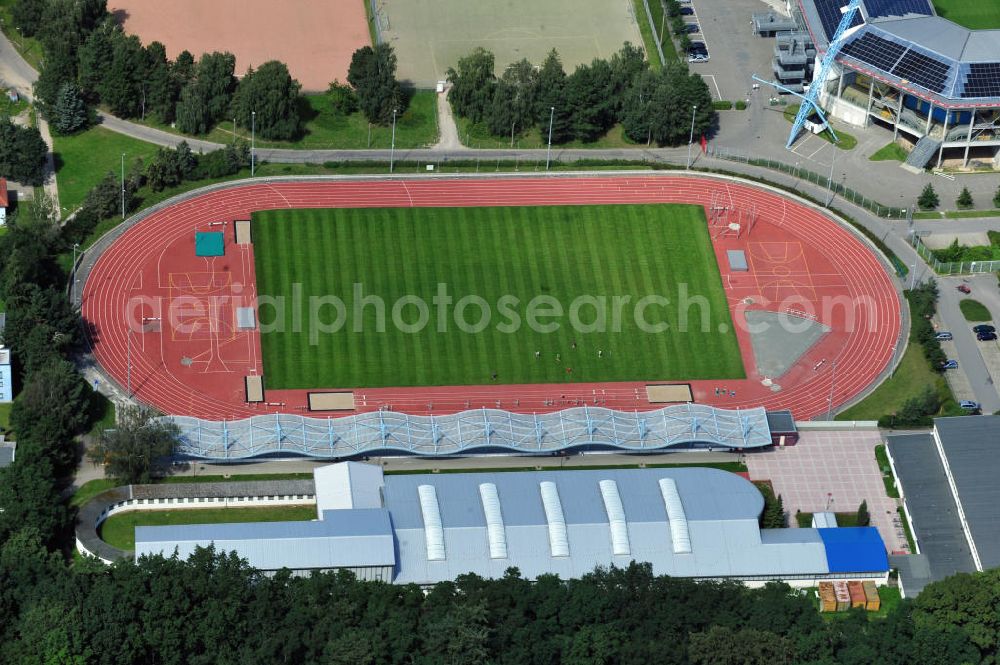 Rostock from the bird's eye view: Im Leichtathletikstadion in Rostock, Mecklenburg-Vorpommern finden Veranstaltungen und Wettkämpfe des Kreis-Leichtathletik-Verband Rostock e.V. sowie des Leichtathletik-Verband Mecklenburg-Vorpommern statt. Das Stadion befindet sich neben der DKB Arena. The athletic sports stadium is the location for events of the Kreis-Leichtathletik-Verband Rostock e.V. and the Leichtathletik-Verband Mecklenburg-Vorpommern. It is located close to the DKB Arena.