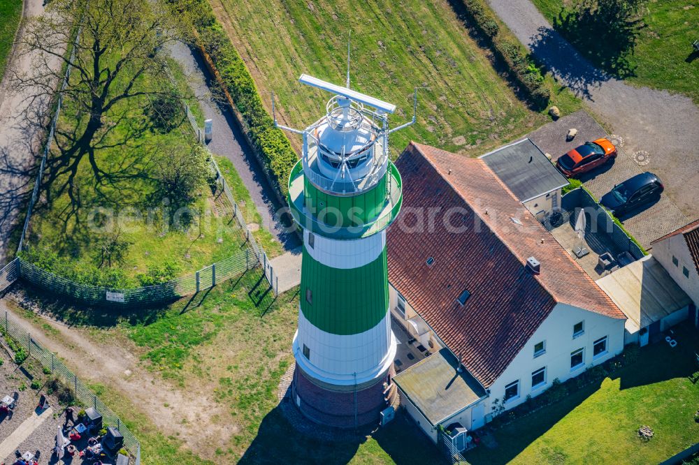 Strande from above - Lighthouse as a historic seafaring character in the coastal area Buelk on street Buelker Weg in Strande in the state Schleswig-Holstein, Germany