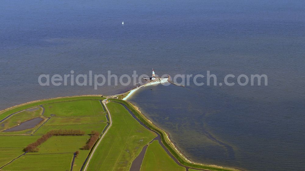 Marken from the bird's eye view: Lighthouse as a historic seafaring character in the coastal area of peninsula in the Markermeer Marken in Nordholland, Niederlande