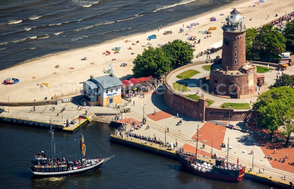 Aerial image Kolobrzeg - Kolberg - Lighthouse as a historic seafaring character in the coastal area of Latarina Morska in Kolberg in West Pomerania, Poland