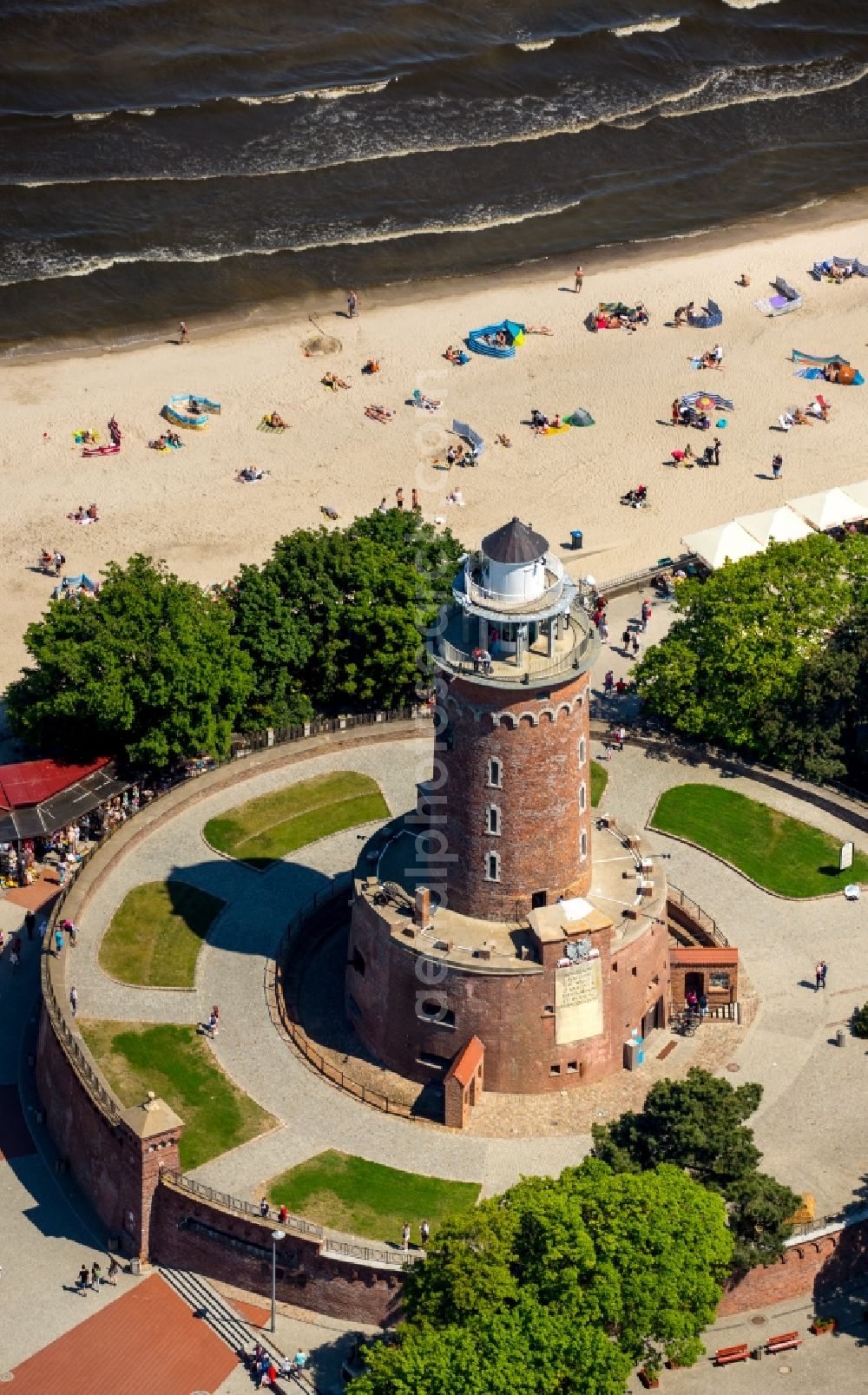 Kolobrzeg - Kolberg from the bird's eye view: Lighthouse as a historic seafaring character in the coastal area of Latarina Morska in Kolberg in West Pomerania, Poland