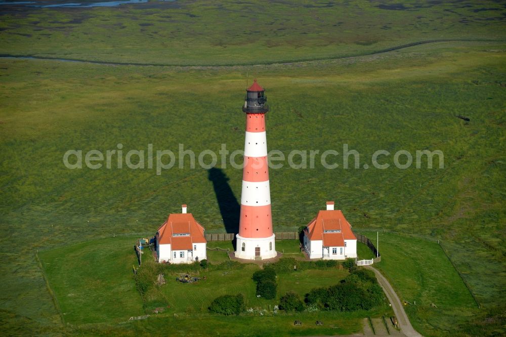 Westerhever from the bird's eye view: Lighthouse as a historic seafaring character in the coastal area of North Sea in the district Hauert in Westerhever in the state Schleswig-Holstein