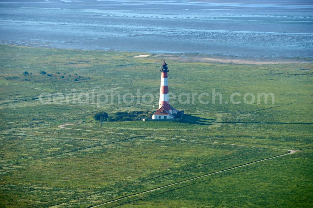 Aerial image Westerhever - Lighthouse as a historic seafaring character in the coastal area of North Sea in the district Hauert in Westerhever in the state Schleswig-Holstein