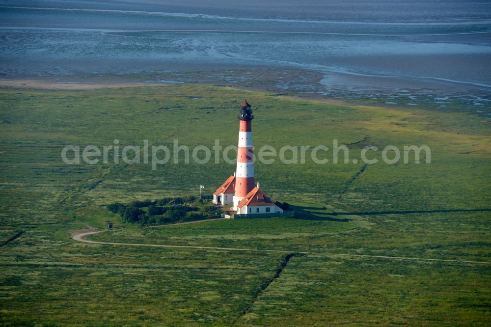 Aerial photograph Westerhever - Lighthouse as a historic seafaring character in the coastal area of North Sea in the district Hauert in Westerhever in the state Schleswig-Holstein