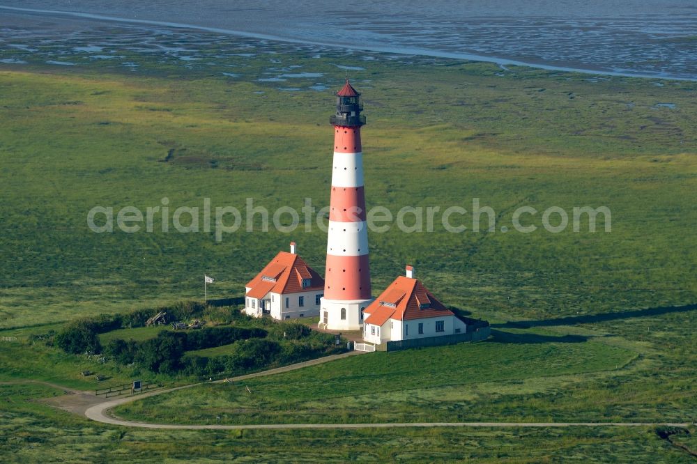 Westerhever from the bird's eye view: Lighthouse as a historic seafaring character in the coastal area of North Sea in the district Hauert in Westerhever in the state Schleswig-Holstein