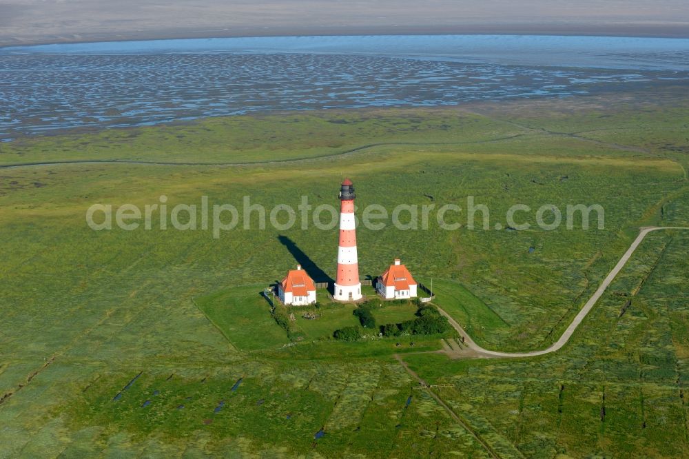 Aerial photograph Westerhever - Lighthouse as a historic seafaring character in the coastal area of North Sea in the district Hauert in Westerhever in the state Schleswig-Holstein