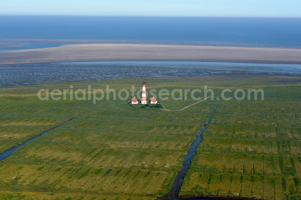 Westerhever from above - Lighthouse as a historic seafaring character in the coastal area of North Sea in the district Hauert in Westerhever in the state Schleswig-Holstein