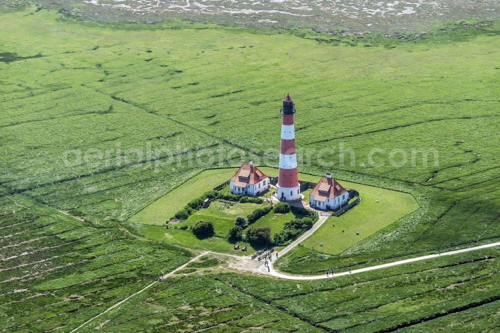 westerhever from above - Lighthouse as a historic seafaring character in the coastal area of North Sea in the district Hauert in Westerhever in the state Schleswig-Holstein